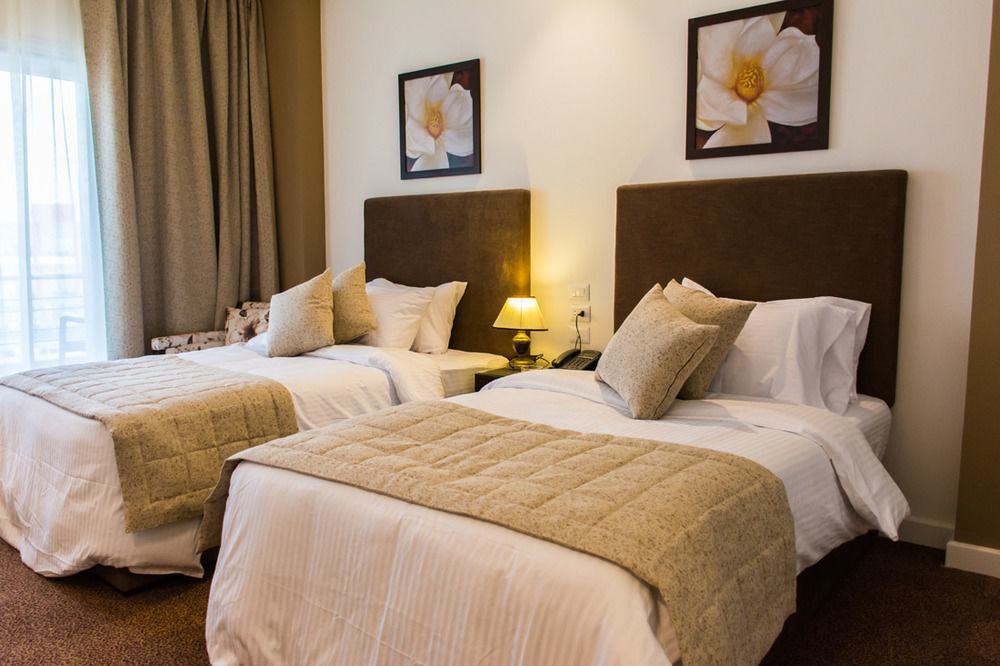 Tolip El Narges Otel Kahire Dış mekan fotoğraf A bedroom at the hotel